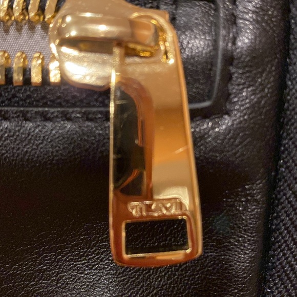 Tumi crossbody bag.
Length is 8.5 inches 
Height is 5.5 inches - Picture 12 of 15